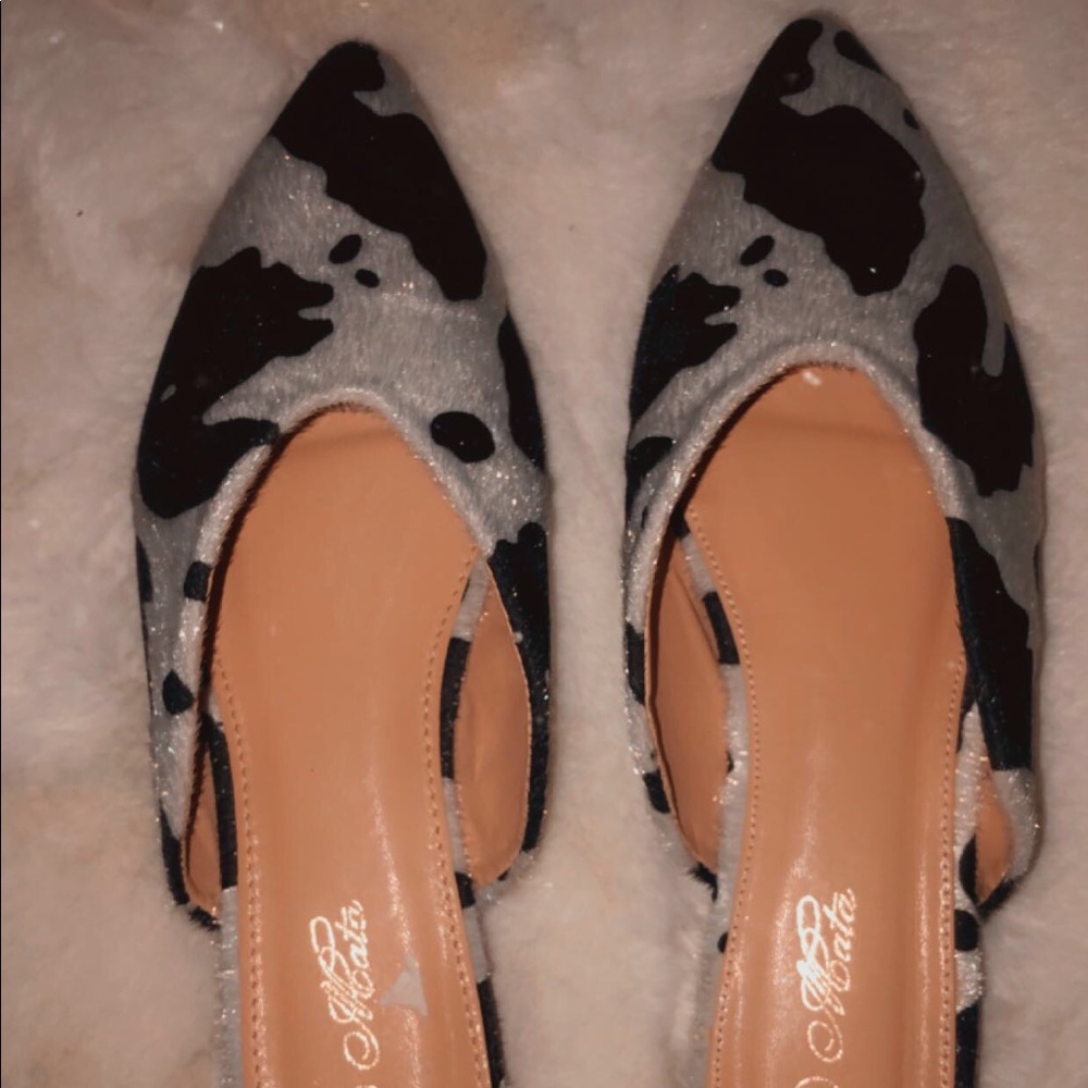 Cow print flats.